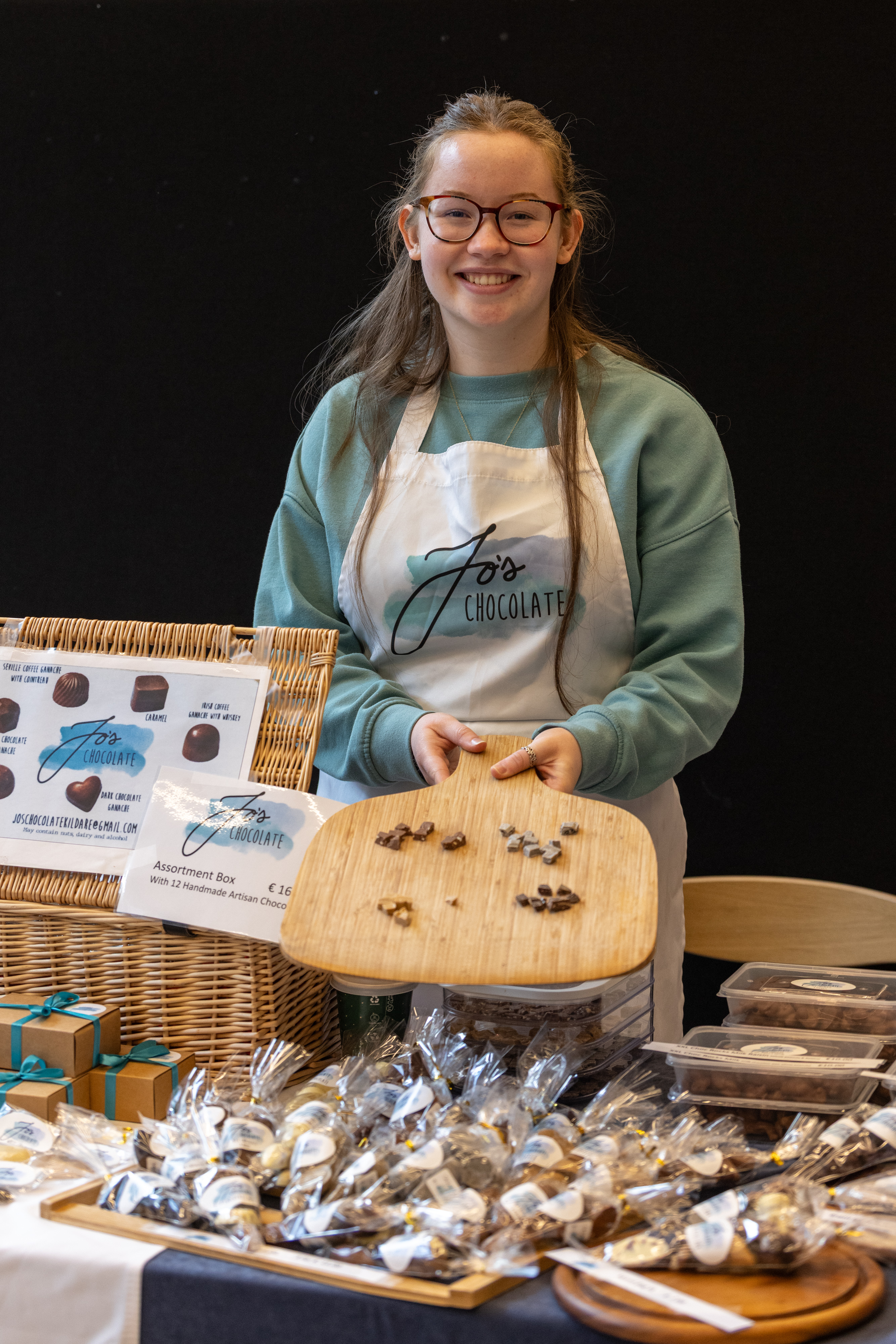 Person serving chocolates.
